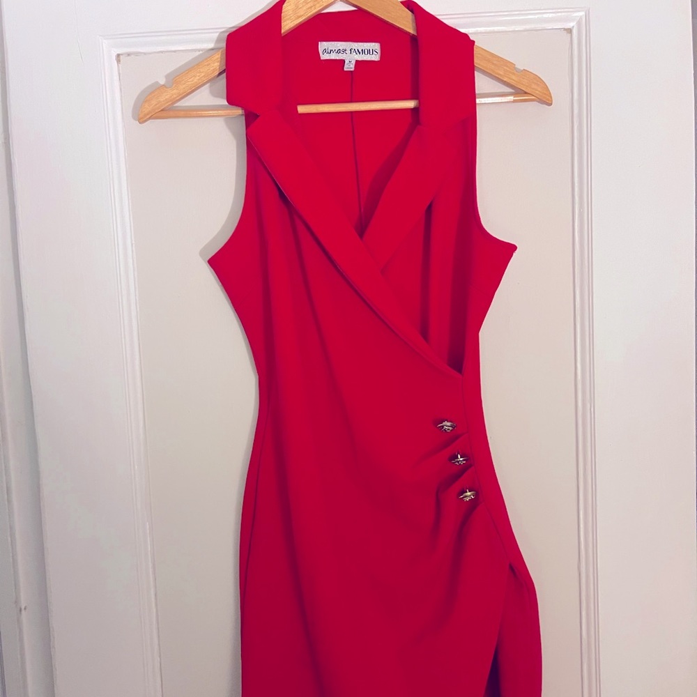 Red business dress with gold accent